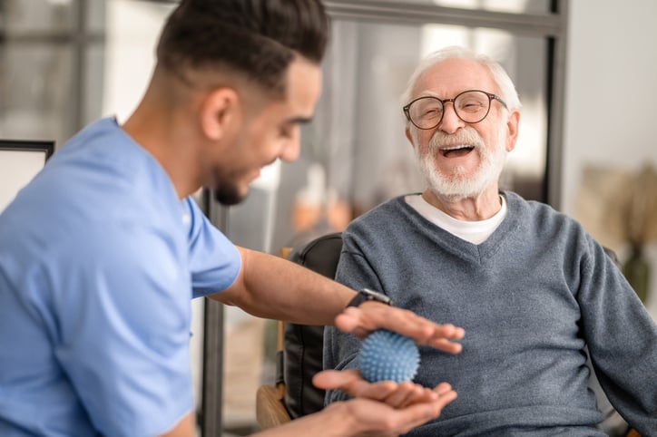 male-european-elderly-patients--rehabilitation-center-smiling-during-physical-therapy-web